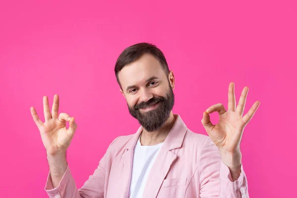 Portrait Smiling Young Man Pink Jacket Man Showing Gesture While — Stock Photo, Image