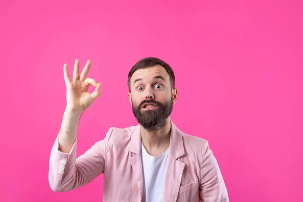 Portrait Smiling Young Man Pink Jacket Man Showing Gesture While — Stock Photo, Image