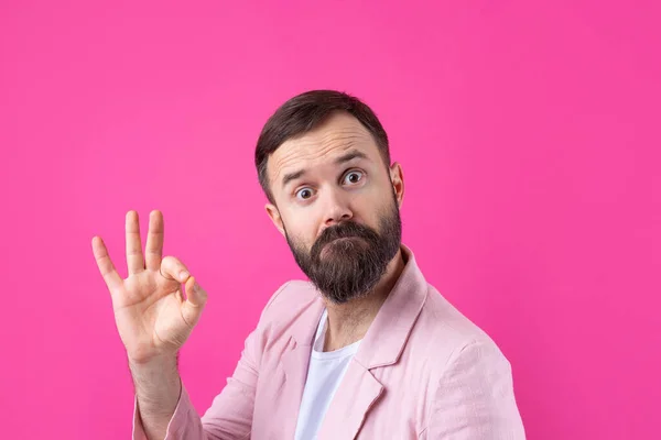 Portrait Smiling Young Man Pink Jacket Man Showing Gesture While — Stock Photo, Image