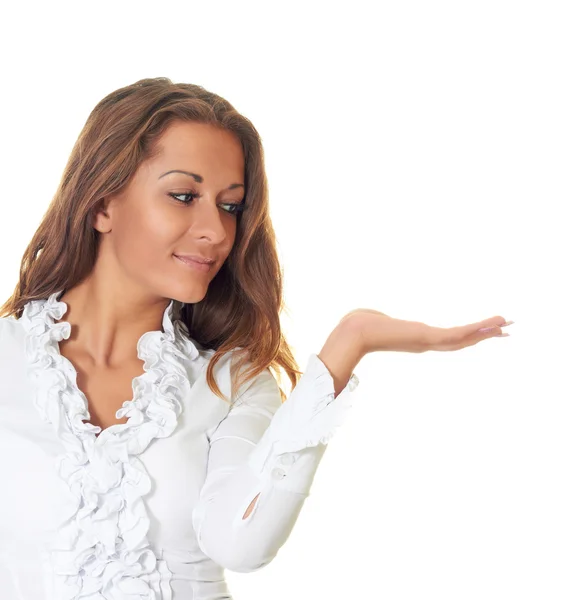 Attractive girl in a white blouse holding in her left hand an im — Stock Photo, Image