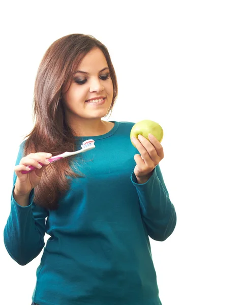 Attractive smiling girl in a blue shirt holding in her right han — Stock Photo, Image