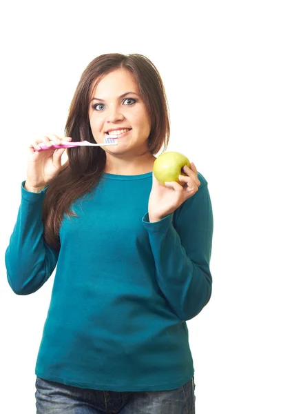 Attractive smiling girl in a blue shirt holding in her right han — Stock Photo, Image