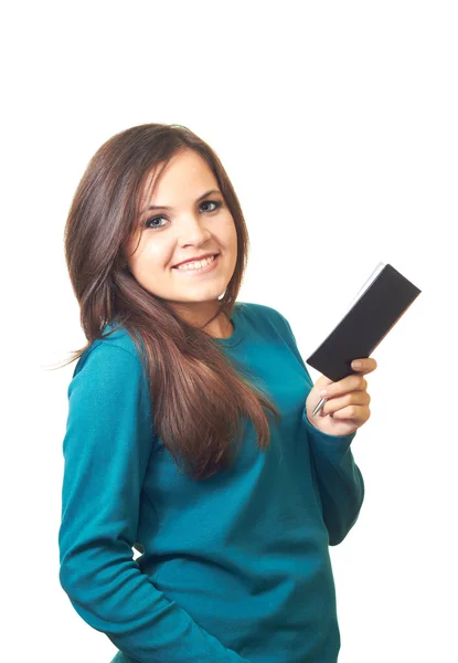 Menina sorridente atraente em uma camisa azul segurando um caderno em ele — Fotografia de Stock