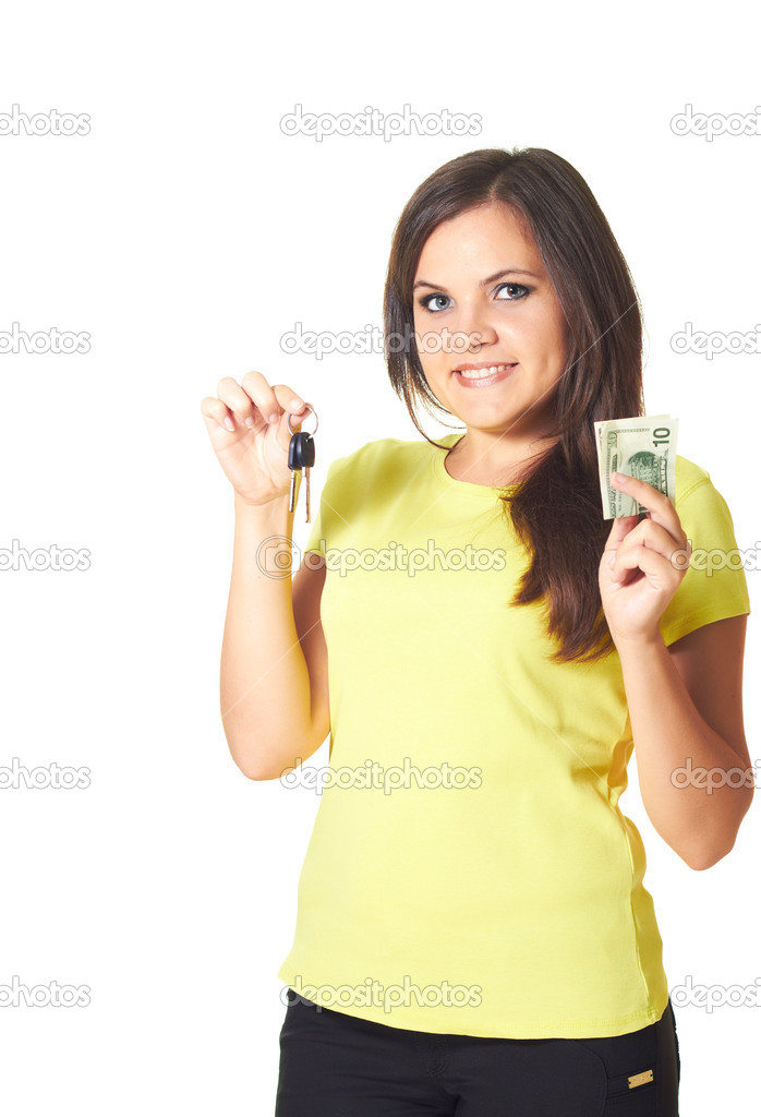 Attractive smiling girl in a yellow shirt holding keys in her ri