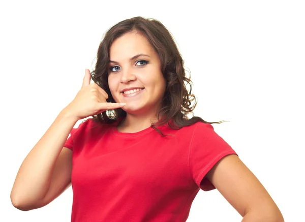 Attractive girl in a red shirt shows the sign phone her right ha — Stock Photo, Image