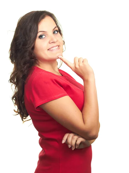 Attractive smiling girl in a red shirt is dreaming and holding h — Stock Photo, Image