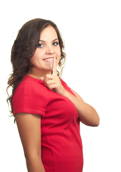 Aantrekkelijk meisje in rood shirt maken een houden het rustig gebaar. — Stockfoto