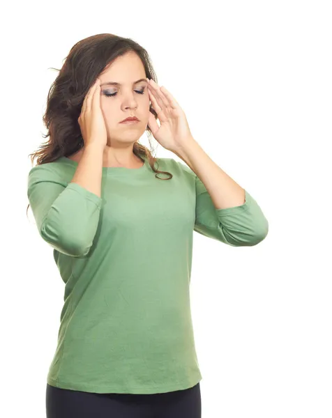 Menina atraente em uma camisa verde, sofrendo de dor na hea — Fotografia de Stock