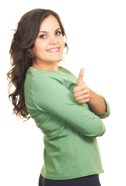 Atraktivní usmívající se dívka v zelené tričko ukazuje palec. — Stock fotografie