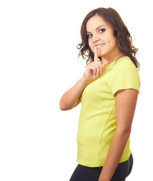 Attractive girl in yellow shirt makes keep it a secret gesture. — Stock Photo, Image