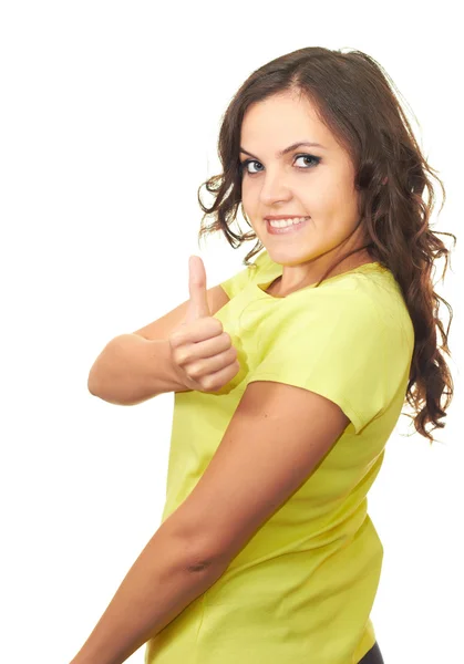 Atractiva chica sonriente en camisa amarilla mostrando los pulgares hacia arriba . — Foto de Stock