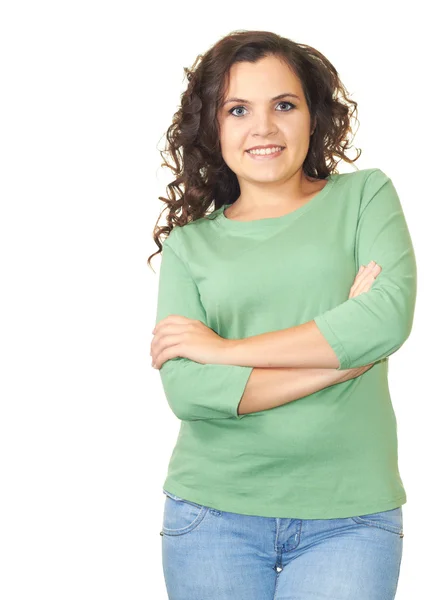 Attractive smiling girl in green shirt standing with hands folde — Stock Photo, Image