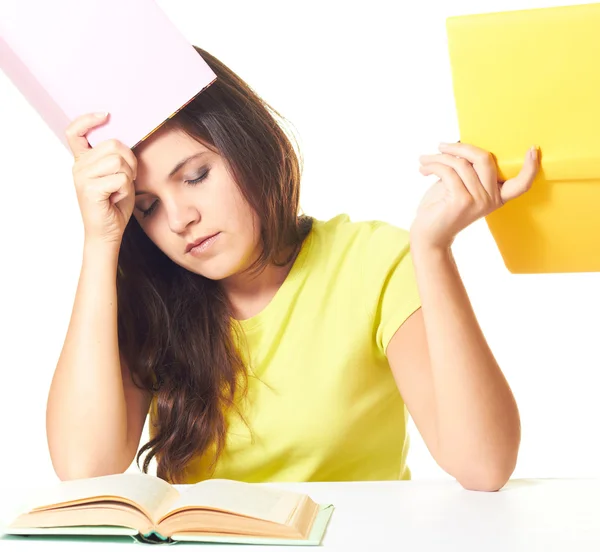 Tired girl in yellow shirt with closed eyes sitting at the table — Stock Photo, Image