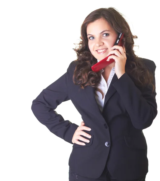 Attraente giovane ragazza sorridente in un abito da lavoro nero parlando o — Foto Stock