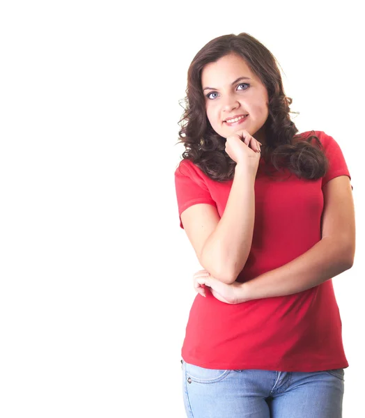 Muchacha sonriente atractiva en una camisa roja y vaqueros azules de pie w —  Fotos de Stock