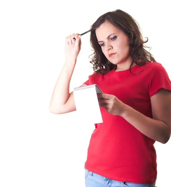 Attractive smiling girl in a red shirt thinking and holding a no — Stock Photo, Image