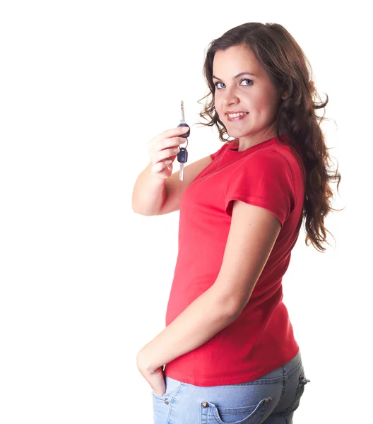 Attractive smiling girl in a red shirt holds in her right hand k — Stock Photo, Image