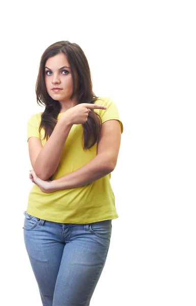 Attractive young woman in a yellow shirt shows the thumb of the — Stock Photo, Image