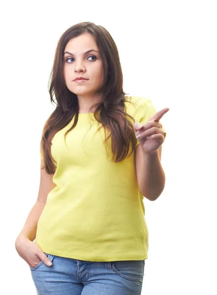 Attractive young woman in a yellow shirt shows finger of her lef — Stock Photo, Image