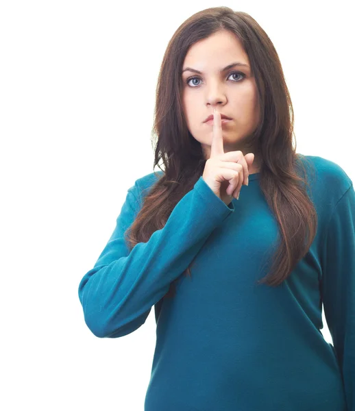 Attraktiv ung kvinna i en blå skjorta visar tecken på tystnad — Stockfoto