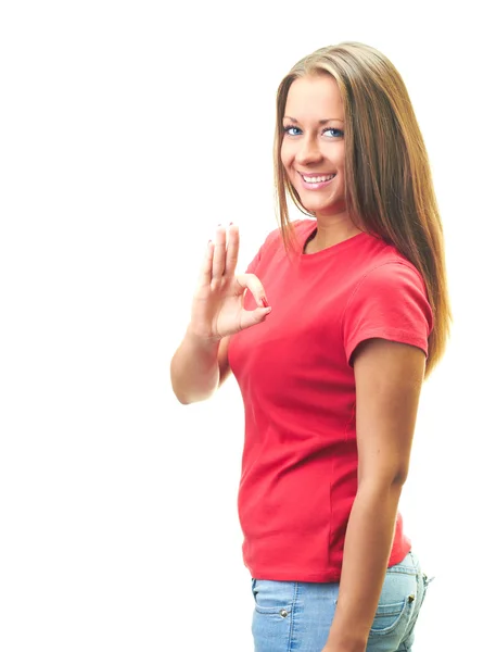 Attractive smiling young woman in a red shirt shows her right ha — Stock Photo, Image