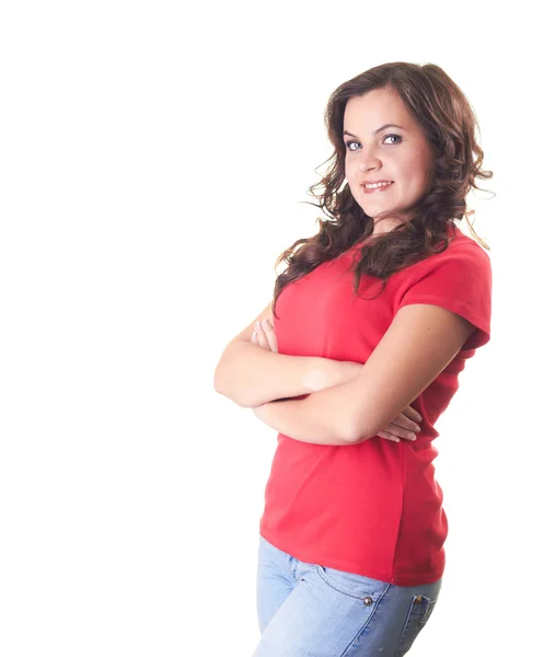 Atrakcyjny dziewczynka uśmiechający się w czerwoną koszulę i niebieskie dżinsy stałego w Obrazek Stockowy