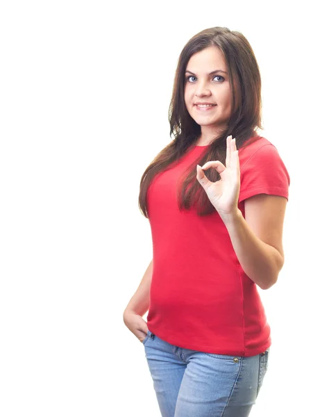빨간 셔츠에 매력적인 웃는 젊은 여 자가 그녀의 왼쪽된 한 보여줍니다. — 스톡 사진