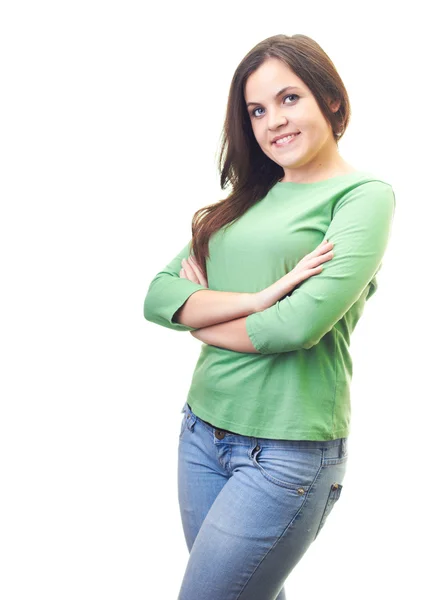Yeşil tişörtlü ayakta el ile çekici gülümseyen genç kadın — Stok fotoğraf