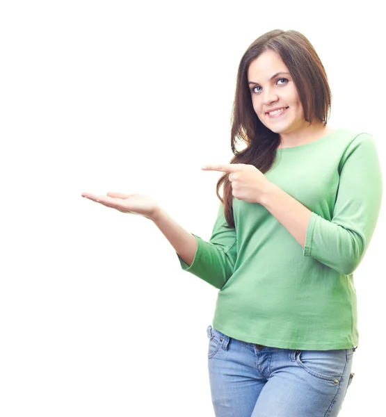 Attractive smiling young woman in a green shirt holding in her r — Stock Photo, Image
