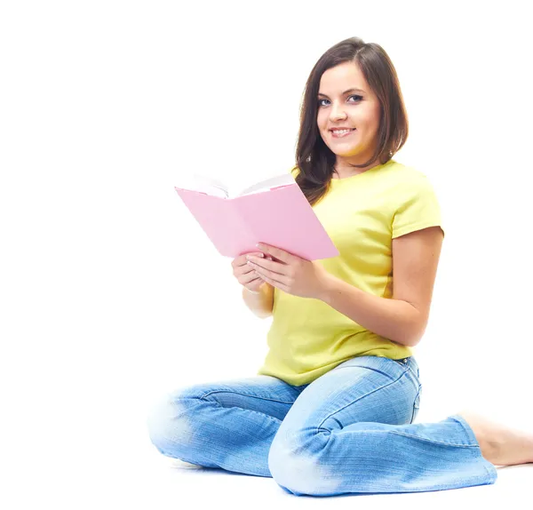 Attractive smiling young woman in a yellow shirt sitting on the — Stock Photo, Image