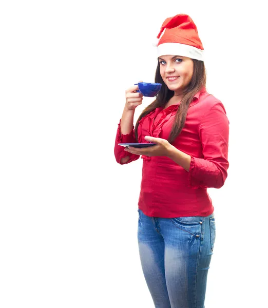 Attractive smiling young woman in a red shirt and Christmas hat — Stock Photo, Image