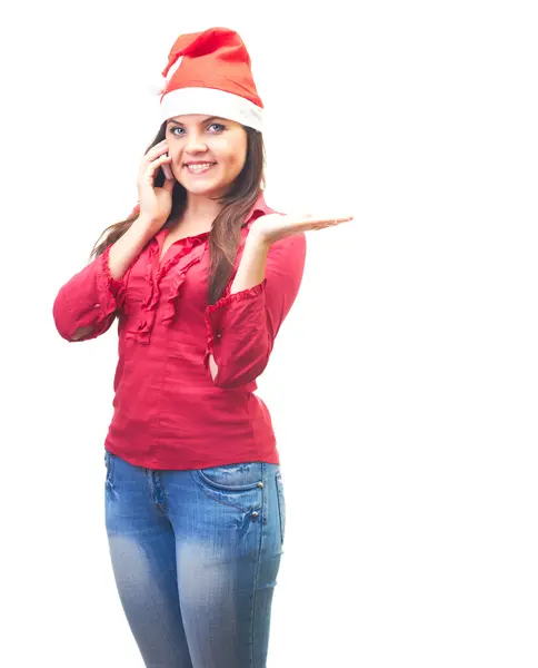 Attractive young woman in a red shirt and Christmas hat talking — Stock Photo, Image