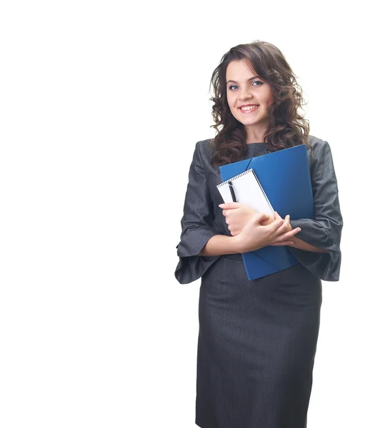 Attraktive lächelnde junge Frau in einem grauen Business-Kleid hält — Stockfoto