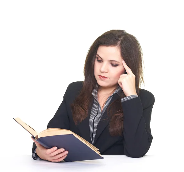 Attractive smiling young woman in black jacket sitting at the ta — Stock Photo, Image