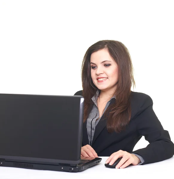 Attractive smiling young woman in black jacket sitting at the ta — Stock Photo, Image