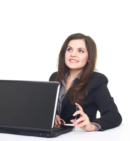 Attractive smiling young woman in black jacket sitting at the ta — Stock Photo, Image