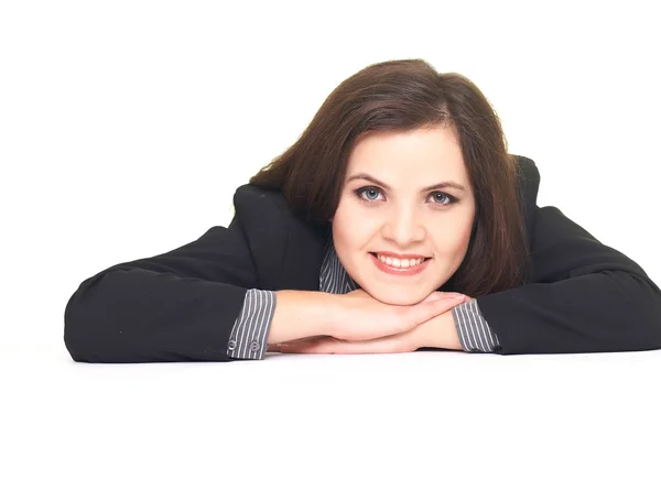Attractive smiling young woman in black jacket sitting at the ta — Stock Photo, Image