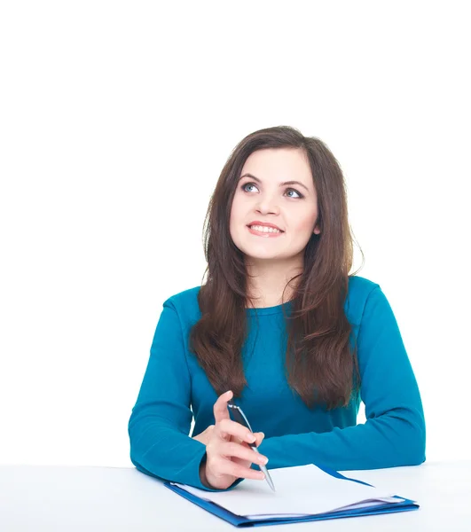 Attractive smiling young woman in a blue shirt works with docume — Stock Photo, Image