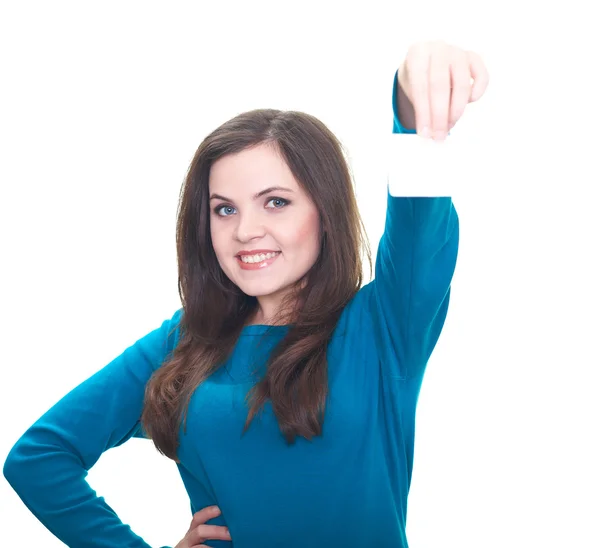 Atractiva joven sonriente en una camisa azul sosteniendo en su le — Foto de Stock
