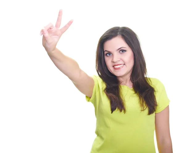 Attractive young woman in a yellow shirt shows her right hand a — Stock Photo, Image