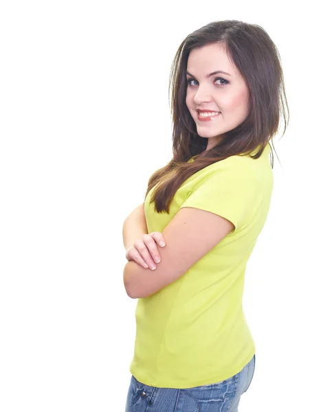 Attractive smiling young woman in a yellow shirt standing with h — Stock Photo, Image