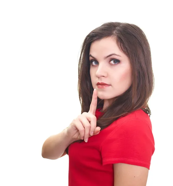 Attractive young woman in a red shirt holding her finger near he — Stock Photo, Image