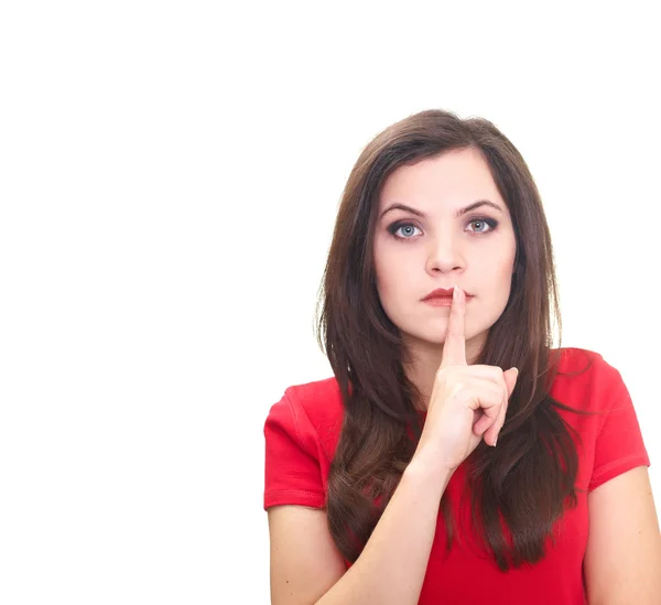 Attractive young woman in a red shirt holding her finger near he — Stock Photo, Image