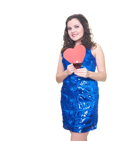 Attractive smiling young woman in a blue shiny dress holding gla — Stock Photo, Image