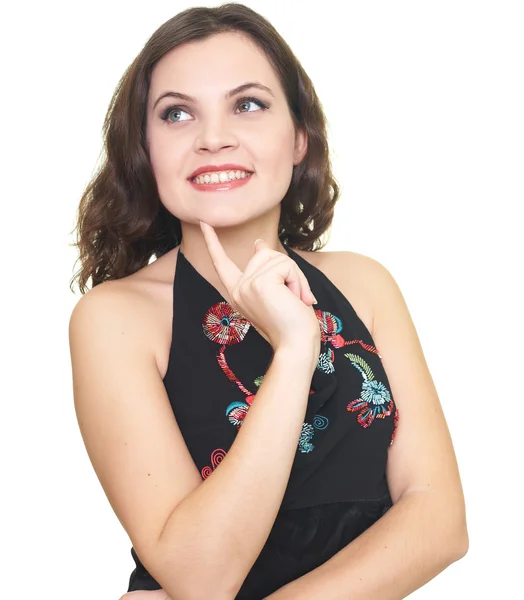 Szczęśliwa młoda kobieta w czarnej koszuli patrząc co prawym górnym — Zdjęcie stockowe