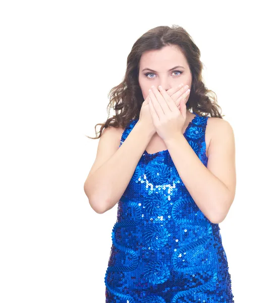 Attractive smiling young woman in shiny blue dress covers her mo — Stock Photo, Image