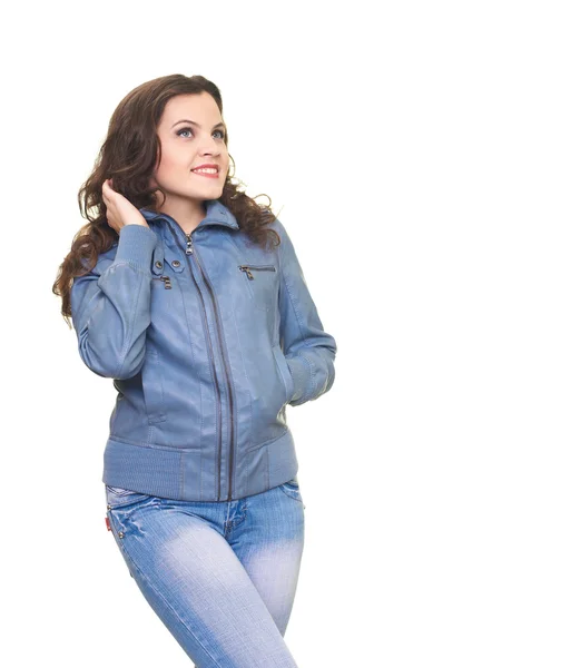 Attractive smiling young woman in a gray jacket corrects her hai — Stock Photo, Image