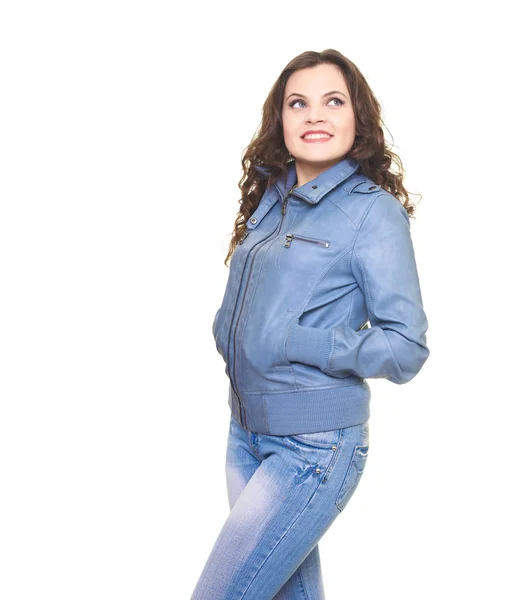 Atractiva joven sonriente en una chaqueta gris se ve en la parte superior —  Fotos de Stock