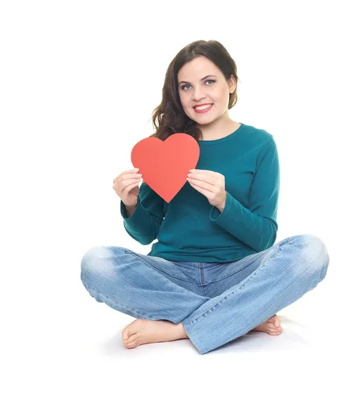 Mujer joven feliz en una camisa azul y vaqueros azules sentados en el — Foto de Stock