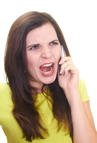 Attractive young woman in a yellow shirt talking on a mobile pho Stock Picture